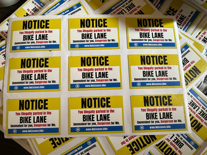 "Notice: You illegally parked in the bike lane" sticker